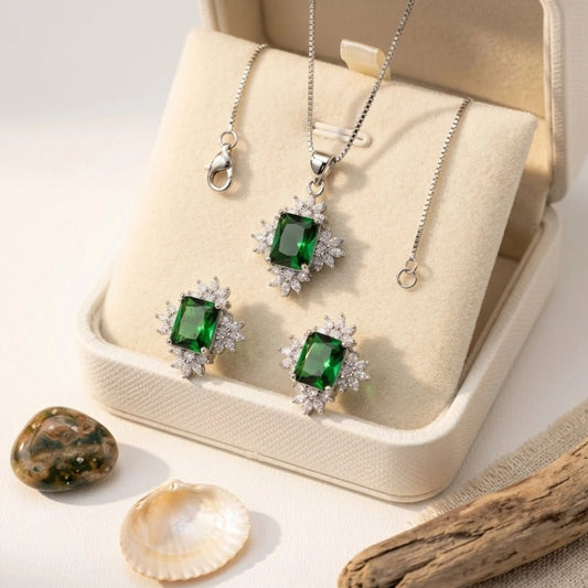 Elegant Sun Flower Style Necklace & Earrings Set - Elegant Sun Flower Style Necklace & Earrings SetJewelryGlow With NazGlow With NazN-N012N-N012silver jewelry set featuring an emerald - cut green crystal pendant necklace and matching stud earrings, both surrounded by a sparkling cubic zirconia floral halo