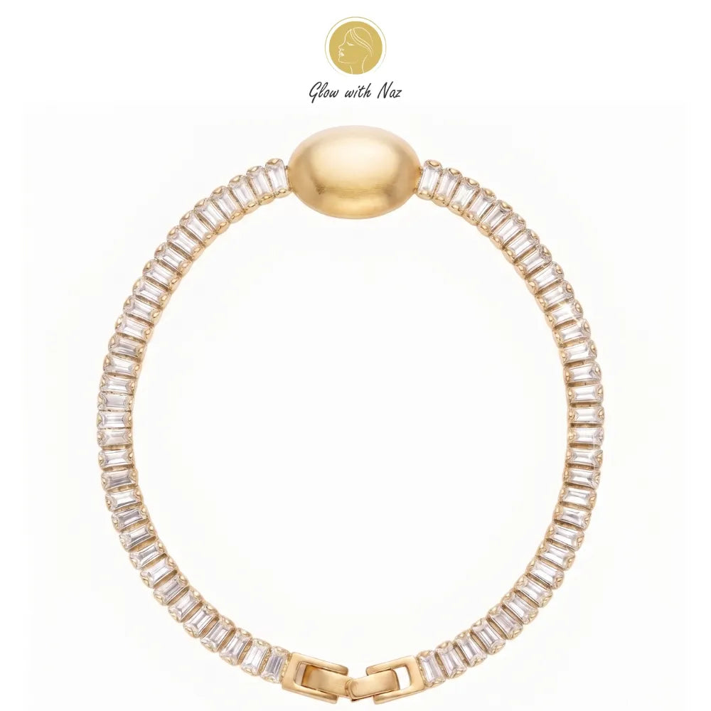 Close-up of a woman's hand wearing the aesthetic crystal oval golden bracelet by Glow With Naz