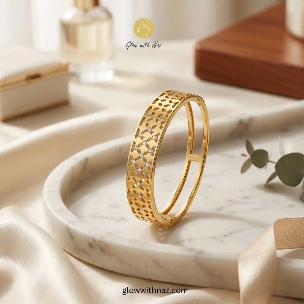 Gold Filigree Cutwork Zircon Bangle Bracelet - Gold Filigree Cutwork Zircon Bangle BraceletJewelryGlow With NazGlow With NazN-B034N-B034Gold filigree cutwork bangle with sparkling zircon stones on marble tray — anti - tarnish stainless steel bangle online in Pakistan by Glow with Naz
