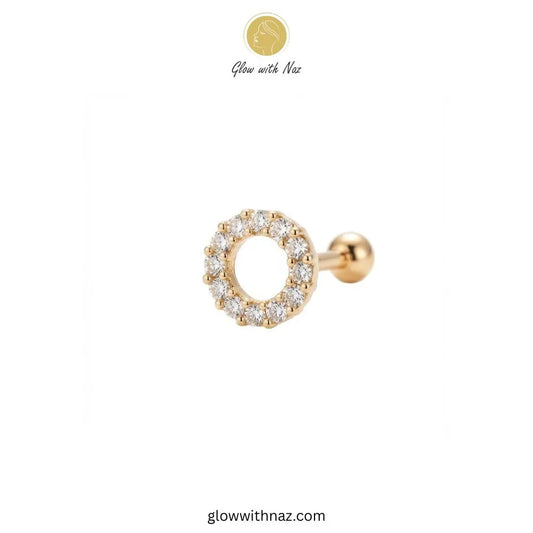 Gold hollow circle CZ stud worn on a helix cartilage ear piercing by Glow With Naz