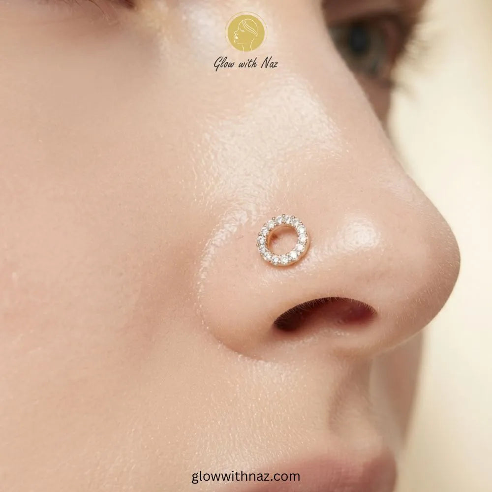 Gold hollow circle CZ stud worn as a nose pin piercing by Glow With Naz