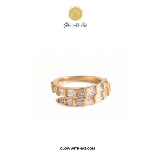 Golden Arrow Crystal Ring for Women - Golden Arrow Crystal Ring for WomenJewelryGlow With NazGlow With NazR0027A gold band ring featuring multiple channels of baguette-cut clear stones, displayed on a clean white background with the brand logo 'Glow with Naz' at the top and 'GLOWWITHNAZ.COM' at the bottom. ring, girls rings, rings for girls, rings simple, simple rings, stainless steel jewelry, jewellery set, aesthetic jewelry, simple jewellery, chain, jewelry, artificial jewellery