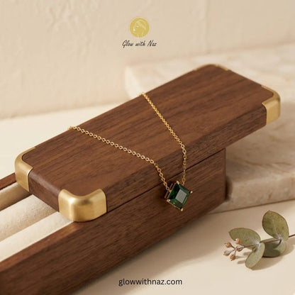Green Square Zircon Gold Pendant Necklace - Green Square Zircon Gold Pendant NecklaceJewelryGlow With NazGlow With NazN-N034N-N034Emerald green square - cut zircon pendant on gold stainless steel chain displayed in dark green velvet - lined wooden jewelry box — anti - tarnish necklace by Glow with Naz