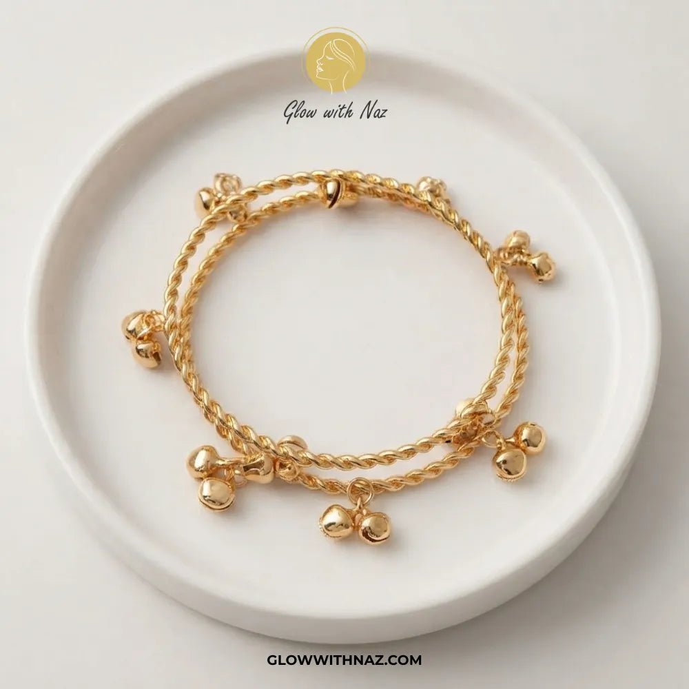 Kashmiri Ghungroo Twisted Gold Bangle Set - #Kashmiri Ghungroo Twisted Gold Bangle SetJewelryGlow With NazGlow With NazB00714 PCSGold Kashmiri twisted rope ghungroo bangle set of 2 on ceramic dish by Glow With Naz#
