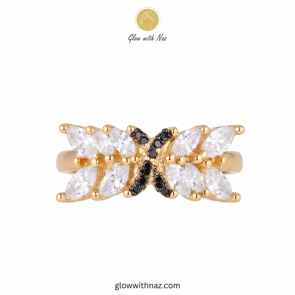 Marquise crystal statement ring with black pave cross emblem in gold by Glow With Naz