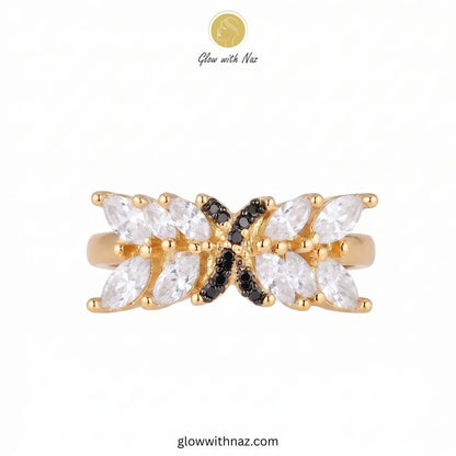 Marquise crystal statement ring with black pave cross emblem in gold by Glow With Naz