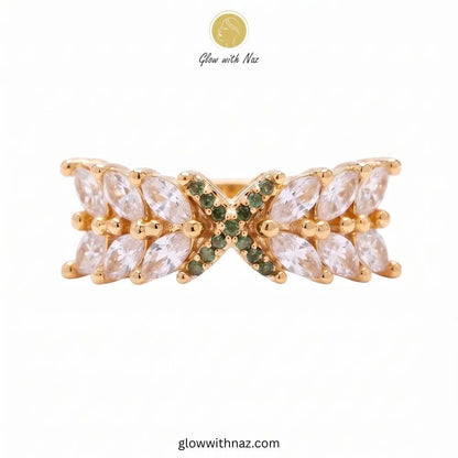 Marquise crystal statement ring with green pave cross emblem by Glow With Naz