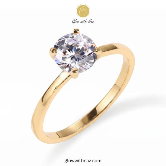 Minimal Golden Round Diamond Adjustable Statement Ring for Her - Minimal Golden Round Diamond Adjustable Statement Ring for HerJewelryGlow With NazGlow With NazR019A yellow gold solitaire engagement ring with a round brilliant-cut clear gemstone, shown on a white background with a 'Glow with Naz' logo overlay. ring, girls rings, rings for girls, rings simple, simple rings, stainless steel jewelry, jewellery set, aesthetic jewelry, simple jewellery, chain, jewelry, artificial jewellery