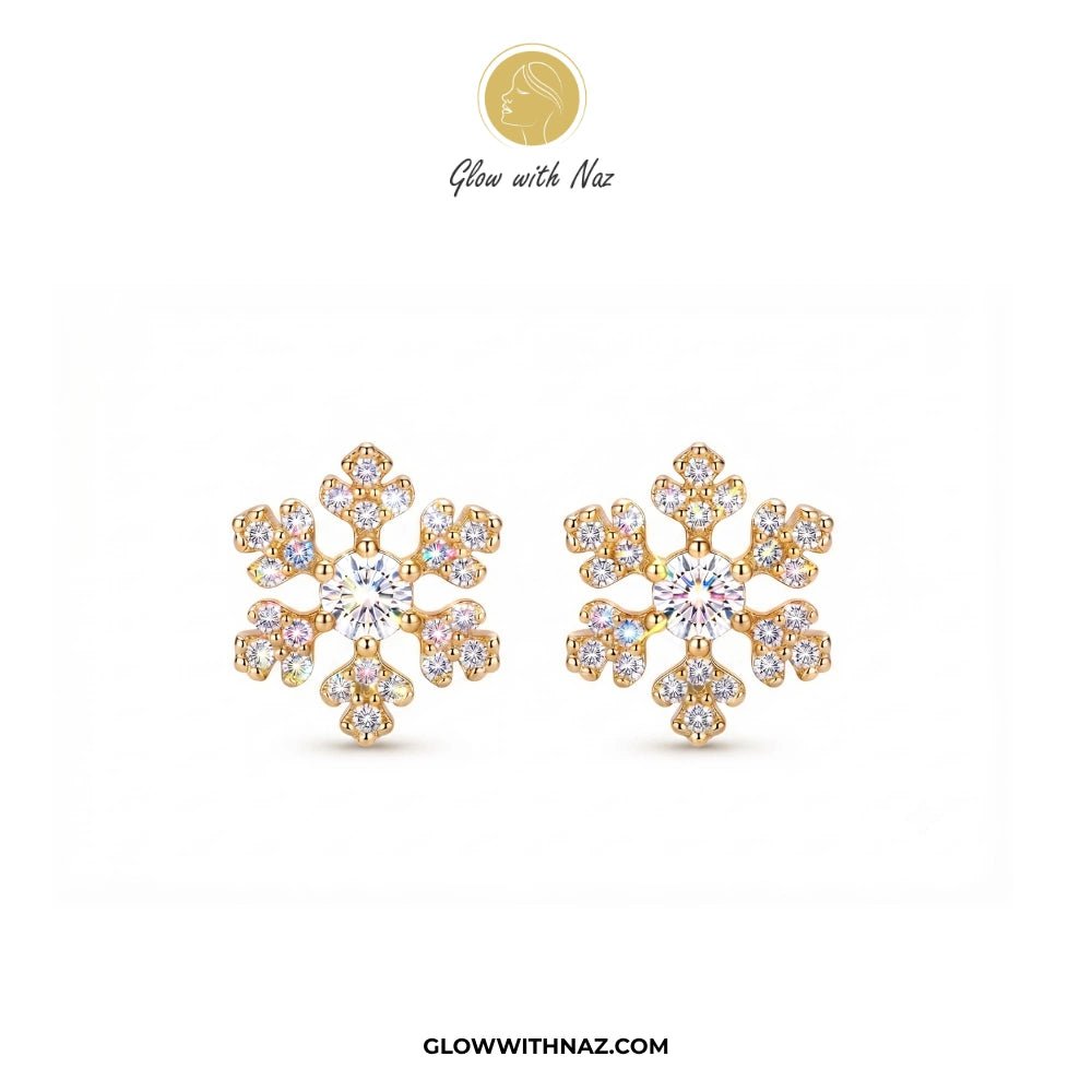Minimal Zircon Snow Flakes Stud Earrings for Women - Minimal Zircon Snow Flakes Stud Earrings for WomenJewelryGlow With NazGlow With NazE032A pair of gold snowflake-shaped stud earrings adorned with clear gemstones, displayed on a clean white background with the brand logo 'Glow with Naz' at the top and 'GLOWWITHNAZ.COM' at the bottom. studs earrings, small earrings, girls earrings, simple earrings, earrings for girls, black earrings, earrings, ear rings, earrings tops, stud earrings, tops earri