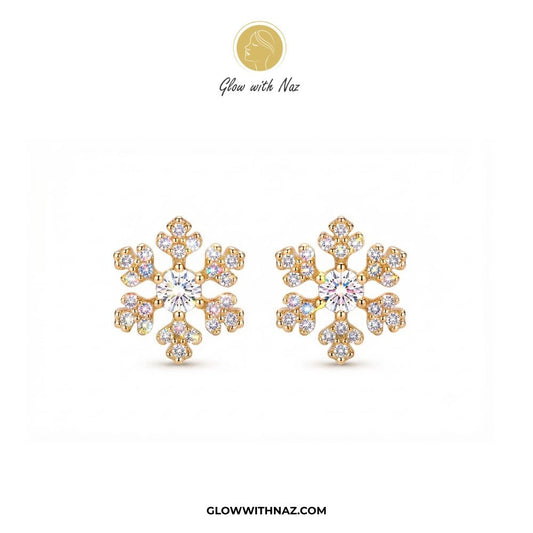 Minimal Zircon Snow Flakes Stud Earrings for Women - Minimal Zircon Snow Flakes Stud Earrings for WomenJewelryGlow With NazGlow With NazE032A pair of gold snowflake-shaped stud earrings adorned with clear gemstones, displayed on a clean white background with the brand logo 'Glow with Naz' at the top and 'GLOWWITHNAZ.COM' at the bottom. studs earrings, small earrings, girls earrings, simple earrings, earrings for girls, black earrings, earrings, ear rings, earrings tops, stud earrings, tops earri