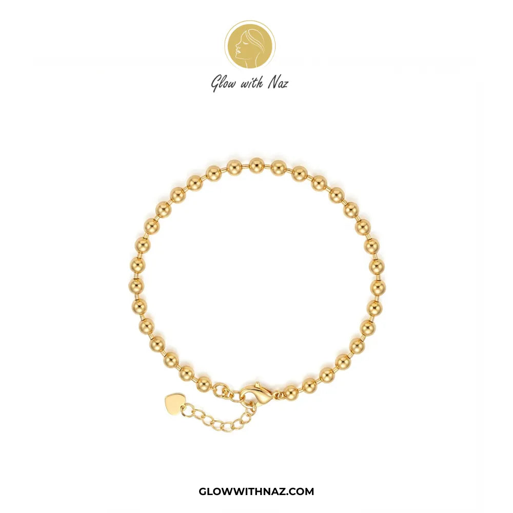 Minimalist gold bead chain bracelet flat lay view on white background by Glow With Naz