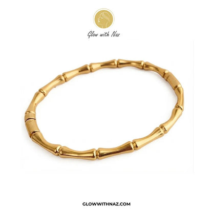 Modern Bamboo Joint Gold Cuff Bangle in Stainless Steel - #Modern Bamboo Joint Gold Cuff Bangle in Stainless SteelJewelryGlow With NazGlow With NazB0072Gold bamboo joint link cuff bangle flat lay view on white background by Glow With Naz#