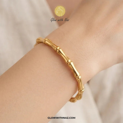 Modern Bamboo Joint Gold Cuff Bangle in Stainless Steel - #Modern Bamboo Joint Gold Cuff Bangle in Stainless SteelJewelryGlow With NazGlow With NazB0072Gold bone segment link cuff bangle worn on model wrist by Glow With Naz#