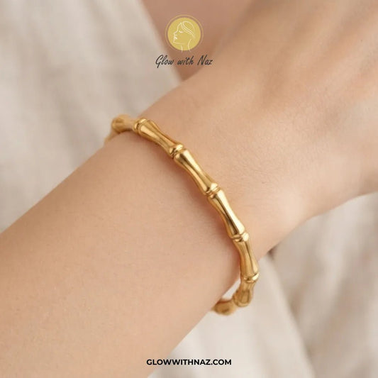 Modern Bamboo Joint Gold Cuff Bangle in Stainless Steel - #Modern Bamboo Joint Gold Cuff Bangle in Stainless SteelJewelryGlow With NazGlow With NazB0072Gold bone segment link cuff bangle worn on model wrist by Glow With Naz#