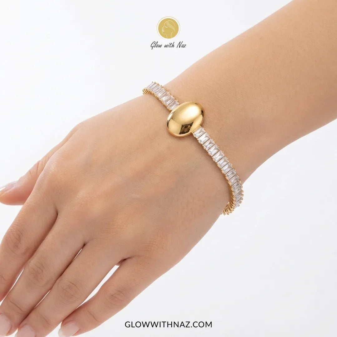 Premium Crystal Oval Gold Bracelet for Women - Premium Crystal Oval Gold Bracelet for WomenJewelryGlow With NazGlow With NazB0060B0060Close-up of a woman's hand wearing the aesthetic crystal oval golden bracelet by Glow With Naz hand cuff bracelet, girls bracelet, bracelet for girls, simple bracelet, chain bracelet, bracelet chain, bracelet watch, hand bracelet, black jewellery, bracelet, ring bracelet, aesthetic bracelet, bracelet for women, bracelet set, cartier bracelet, cute bracelet, jewell