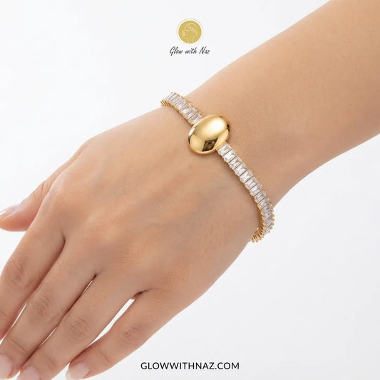 Premium Crystal Oval Gold Bracelet for Women - Premium Crystal Oval Gold Bracelet for WomenJewelryGlow With NazGlow With NazB0060B0060Close-up of a woman's hand wearing the aesthetic crystal oval golden bracelet by Glow With Naz hand cuff bracelet, girls bracelet, bracelet for girls, simple bracelet, chain bracelet, bracelet chain, bracelet watch, hand bracelet, black jewellery, bracelet, ring bracelet, aesthetic bracelet, bracelet for women, bracelet set, cartier bracelet, cute bracelet, jewell