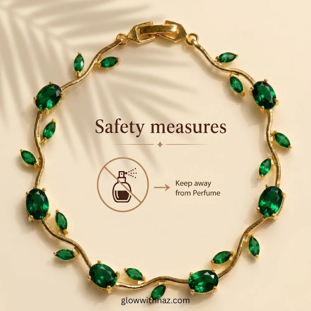 Premium Green Tulip Bracelet | Rapunzel Floral Stainless Steel Bracelet - Premium Green Tulip Bracelet | Rapunzel Floral Stainless Steel BraceletJewelryGlow With NazGlow With NazTB003AGold vine-style bracelet with green marquise and oval stones, shown on a beige background with text reading 'Safety measures' and a perfume icon warning it should be kept away from perfume. Tulip Rapunzel bracelet, floral tulip bracelet, Rapunzel inspired jewelry, aesthetic tulip bracelet, trendy charm bracelet, st