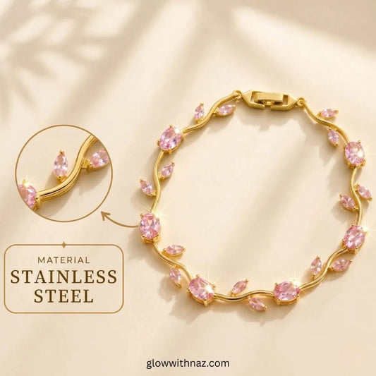 Premium Pink Tulip Bracelet | Rapunzel Floral Stainless Steel Bracelet - Premium Pink Tulip Bracelet | Rapunzel Floral Stainless Steel BraceletJewelryGlow With NazGlow With NazTB005AGold-toned stainless steel bracelet with pink marquise and oval stones, shown on a warm beige background with a circular inset detail and text reading 'MATERIAL STAINLESS STEEL'. Tulip Rapunzel bracelet, floral tulip bracelet, Rapunzel inspired jewelry, aesthetic tulip bracelet, trendy charm bracelet, stainless steel