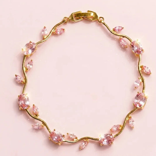 Premium Pink Tulip Bracelet | Rapunzel Floral Stainless Steel Bracelet - Premium Pink Tulip Bracelet | Rapunzel Floral Stainless Steel BraceletJewelryGlow With NazGlow With NazTB005AA gold vine bracelet adorned with marquise-cut pink gemstones, displayed on a soft pink background. Tulip Rapunzel bracelet, floral tulip bracelet, Rapunzel inspired jewelry, aesthetic tulip bracelet, trendy charm bracelet, stainless steel tulip bracelet, gold plated flower bracelet, delicate floral wrist accessory, 