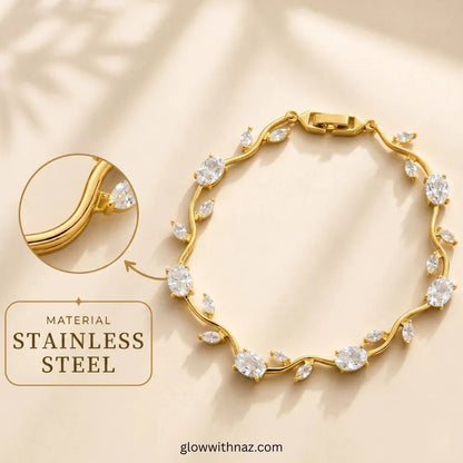 Premium White Tulip Bracelet | Rapunzel Floral Stainless Steel Bracelet - Premium White Tulip Bracelet | Rapunzel Floral Stainless Steel BraceletJewelryGlow With NazGlow With NazTB006AGold-toned stainless steel bracelet with clear marquise and round stones, shown on a warm beige background with a circular inset highlighting the metal and a text callout reading 'MATERIAL Tulip Rapunzel bracelet, floral tulip bracelet, Rapunzel inspired jewelry, aesthetic tulip bracelet, trendy charm bracelet, sta