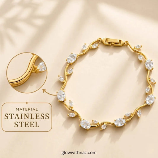 Premium White Tulip Bracelet | Rapunzel Floral Stainless Steel Bracelet - Premium White Tulip Bracelet | Rapunzel Floral Stainless Steel BraceletJewelryGlow With NazGlow With NazTB006AGold-toned stainless steel bracelet with clear marquise and round stones, shown on a warm beige background with a circular inset highlighting the metal and a text callout reading 'MATERIAL Tulip Rapunzel bracelet, floral tulip bracelet, Rapunzel inspired jewelry, aesthetic tulip bracelet, trendy charm bracelet, sta