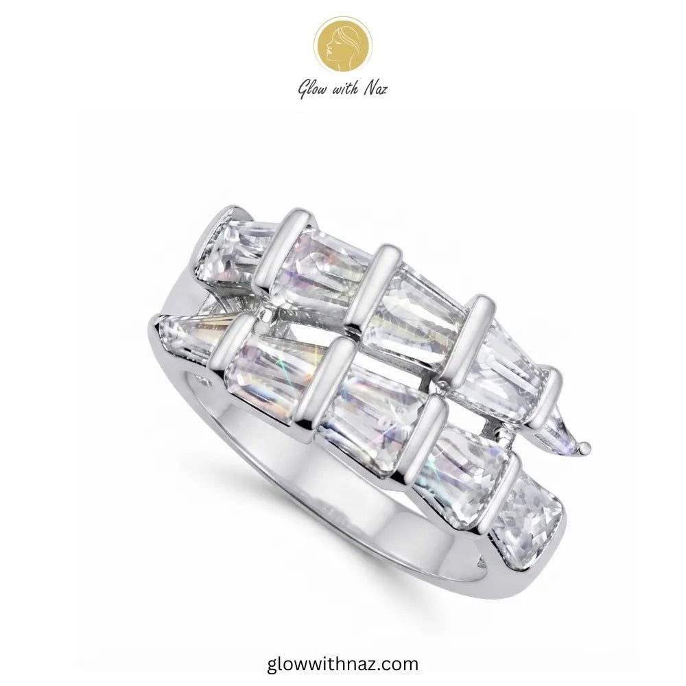 Radiant Adjustable Silver Arrow Diamond Ring - Radiant Adjustable Silver Arrow Diamond RingJewelryGlow With NazGlow With NazR028A silver-toned ring featuring multiple baguette and marquise-cut clear stones arranged in a geometric, interlocking pattern. The brand logo 'Glow with Naz' is visible at the top and the website 'glowwithnaz.