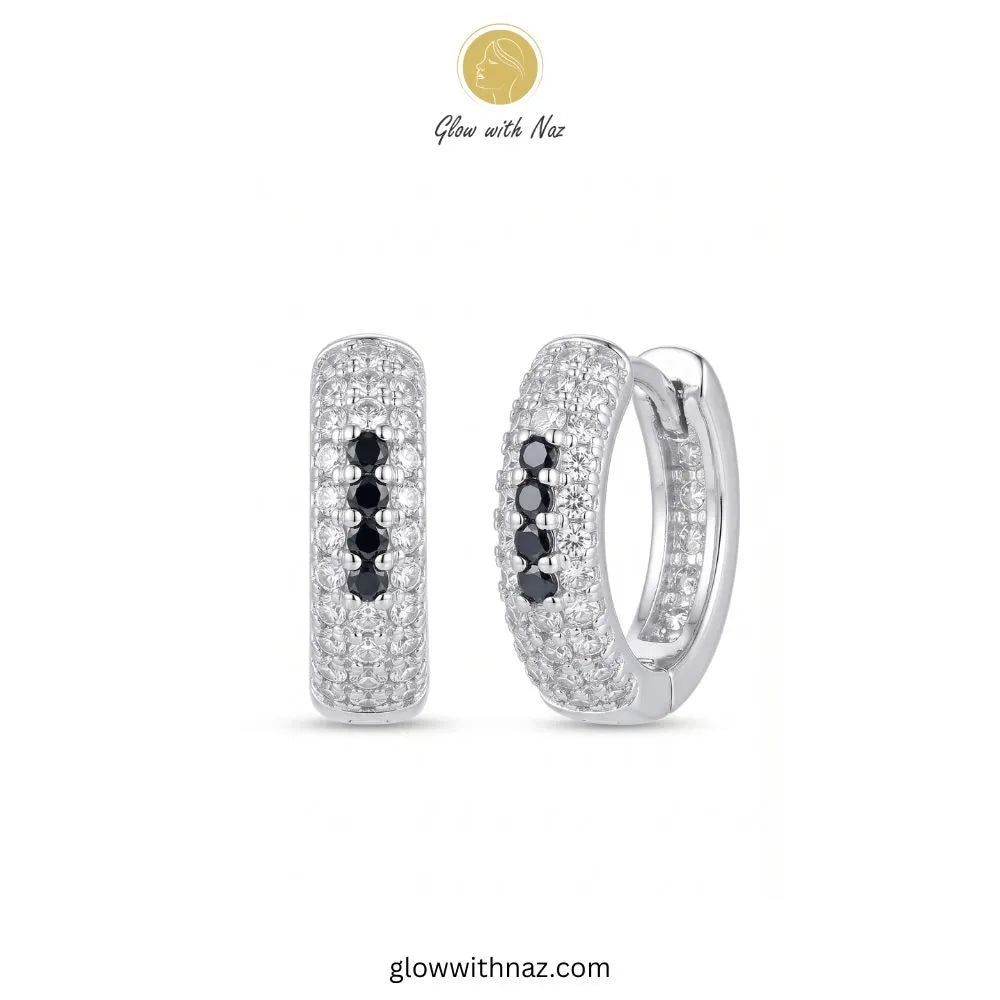 Silver multi row pave zircon huggie hoop earrings featuring 4 black center accent stones by Glow With Naz