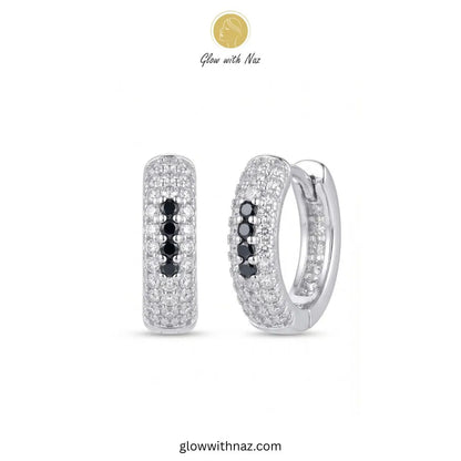 Silver multi row pave zircon huggie hoop earrings featuring 4 black center accent stones by Glow With Naz