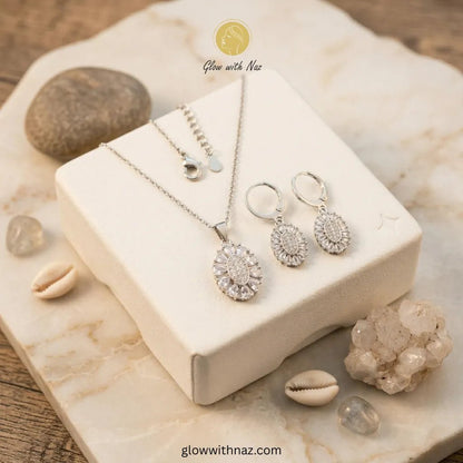 Silver Zircon Necklace Pendant & Hoop Earrings Set - Silver Zircon Necklace Pendant & Hoop Earrings SetJewelryGlow With NazGlow With NazN-N013N-N013Silver Zircon Necklace Pendant & Hoop Earrings Set Pink tulip Necklace with pink stones on a white plate, brand 'Glow with Naz' visible