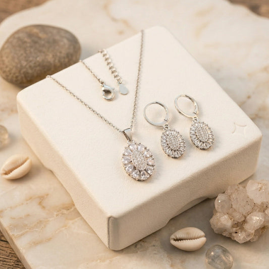 Silver Zirconia Necklace & Hoop Earrings Set - Silver Zirconia Necklace & Hoop Earrings SetJewelryGlow With NazGlow With NazN-N013N-N013Elegant silver - toned jewelry set featuring a sunburst pendant necklace and matching lever - back earrings with clear pavé crystals, displayed in a black velvet wooden gift box