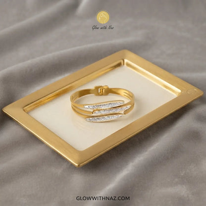 Gold triple fish crystal cuff bracelet front view on plain white background by Glow With Naz