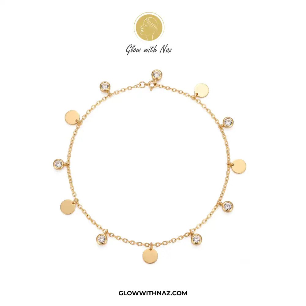 Stainless Steel Diamond Coin Anklet - Stainless Steel Diamond Coin AnkletJewelryGlow With NazGlow With NazA006A gold chain anklet with multiple round gold disc charms and several bezel-set clear stones, displayed on a clean white background with the brand logo 'Glow with Naz' above and 'GLOWWITHNAZ.COM' below.