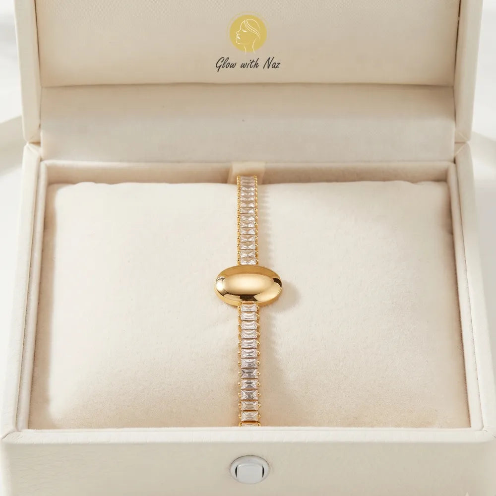Detail shot of the stunning minimalist jewelry featuring sparkling crystals and a smooth gold centerpiece