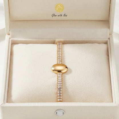 Detail shot of the stunning minimalist jewelry featuring sparkling crystals and a smooth gold centerpiece