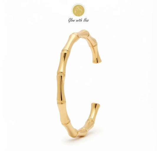 Stunning Stainless Steel Bone Cuff Bracelet - Stunning Stainless Steel Bone Cuff BraceletJewelryGlow With NazGlow With NazB0057B0057Close-up of a woman wearing the Glow With Naz elegant stainless steel bone cuff golden bracelet.