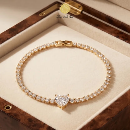 Close-up of a woman's wrist wearing the eye-catching crystal hand chain bracelet, glowing beautifully under warm light