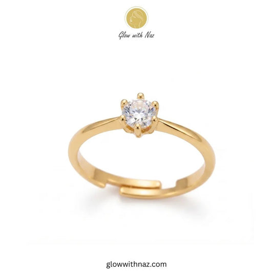 The Signature Adjustable 6-Grip Diamond Solitaire Ring - The Signature Adjustable 6-Grip Diamond Solitaire RingJewelryGlow With NazGlow With NazR024A gold adjustable ring with a single round clear gemstone in a prong setting, shown on a white background with a Glow with Naz logo at the top and glowwithnaz.com at the bottom. ring, girls rings, rings for girls, rings simple, simple rings, stainless steel jewelry, jewellery set, aesthetic jewelry, simple jewellery, chain, jewelry, artificial jewell