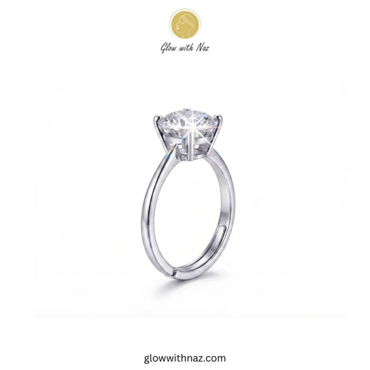 The Signature Adjustable Big Round Silver Diamond Ring - The Signature Adjustable Big Round Silver Diamond RingJewelryGlow With NazGlow With NazR025A silver solitaire engagement ring with a round brilliant-cut diamond center stone, shown on a plain white background with the brand logo 'Glow with Naz' at the top. ring, girls rings, rings for girls, rings simple, simple rings, stainless steel jewelry, jewellery set, aesthetic jewelry, simple jewellery, chain, jewelry, artificial jewellery