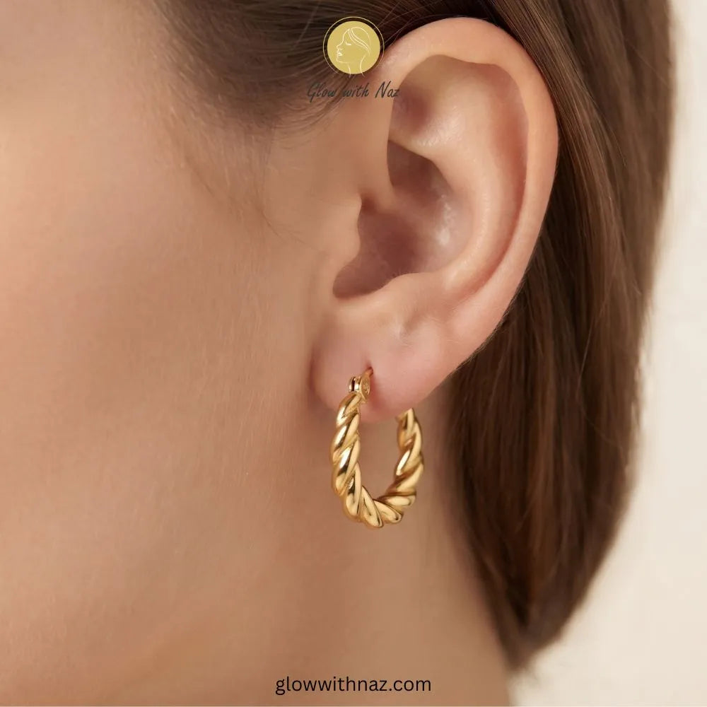Gold thick twisted rope baali earrings on decorative white dish by Glow With Naz
