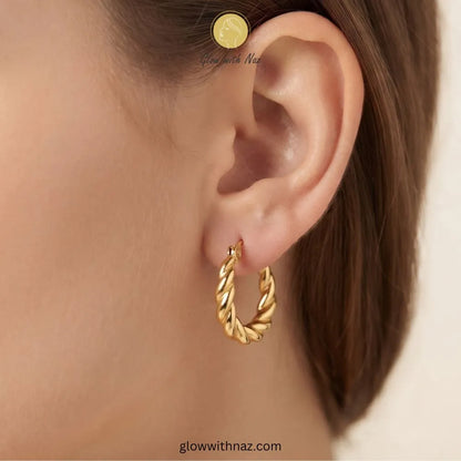 Gold thick twisted rope baali earrings on decorative white dish by Glow With Naz