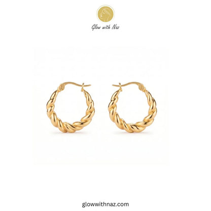 Gold thick twisted baali stainless steel hoop earrings worn on ear model by Glow With Naz