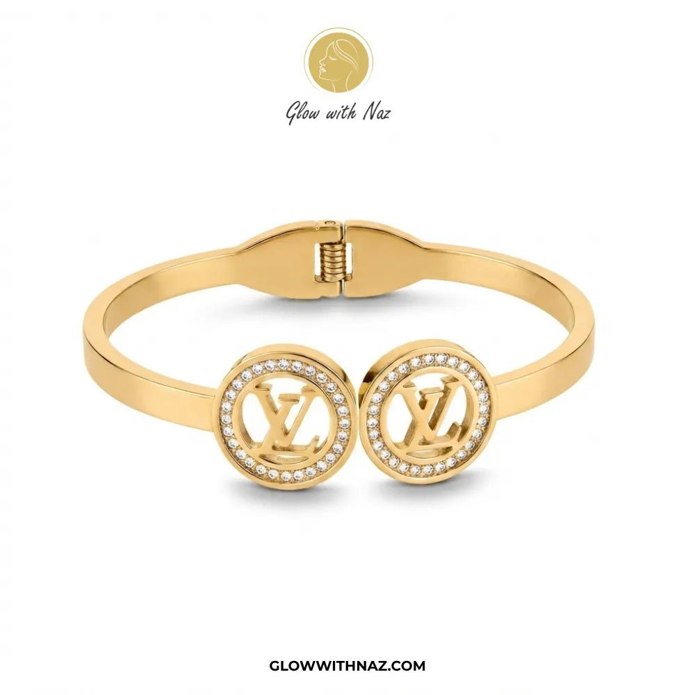 Twin LV Medallion Crystal Handcuff Bangle in Gold - #Twin LV Medallion Crystal Handcuff Bangle in GoldJewelryGlow With NazGlow With NazB0065Gold dual monogram crystal halo handcuff bangle front view by Glow With Naz#