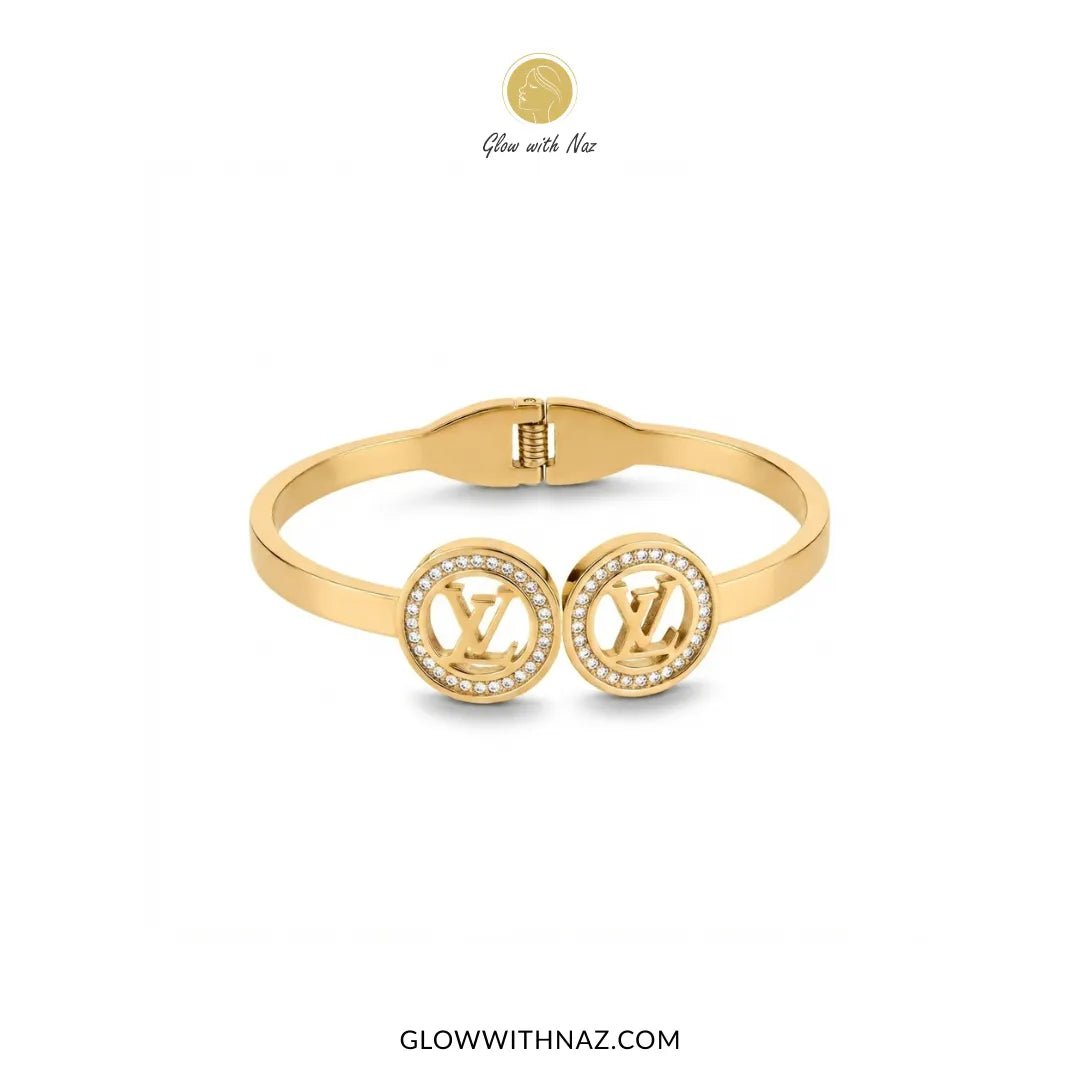 Twin LV Medallion Crystal Handcuff Bangle in Gold - #Twin LV Medallion Crystal Handcuff Bangle in GoldJewelryGlow With NazGlow With NazB0065Gold twin LV medallion crystal handcuff bangle flat lay view by Glow With Naz#